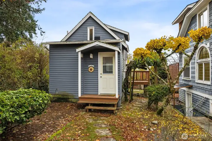 The Cottage is a small home with loft sleeping area, 3/4 bath, mini kitchen and laundry.