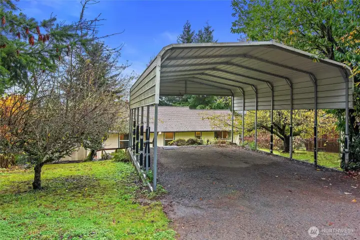 large 2 car carport with stairway down to the back door of the house.