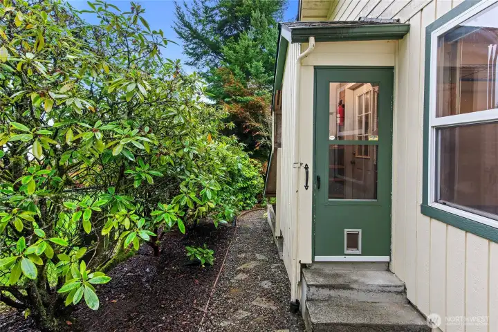 Back door enterance with a small alcove mudroom to the kitchen door.