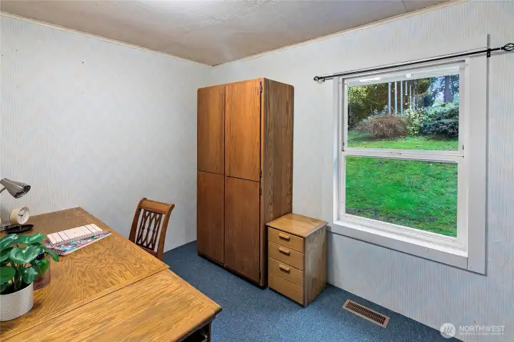 This room is used as an office now and has been a 4th bedroom in the past.  looks out to the back yard.
