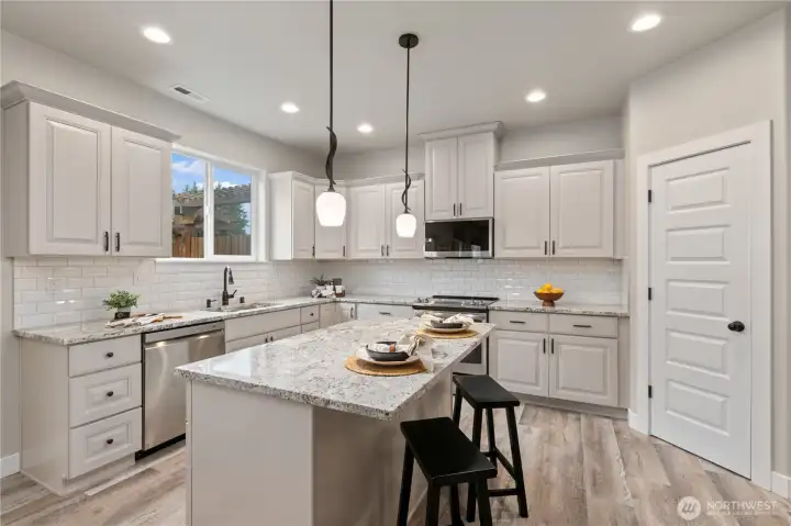 Convenient island with eating area and walk-in pantry