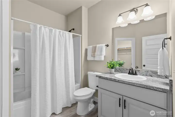 Junior suite's attached bathroom and walk-in closet (not shown)