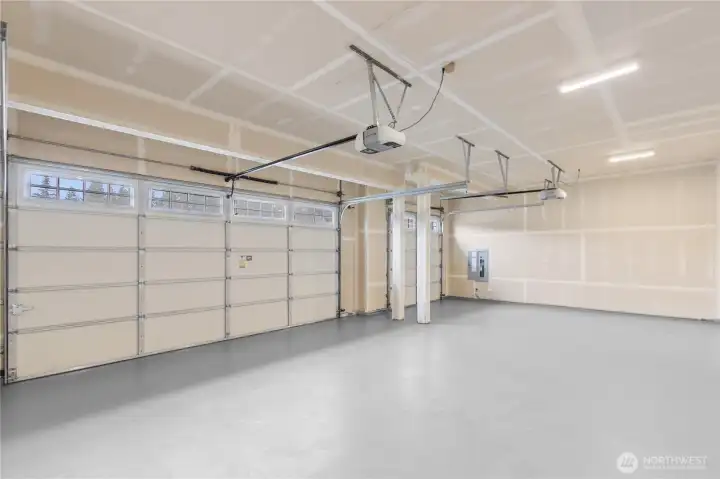 Attached 3-car garage with epoxy-coated flooring
