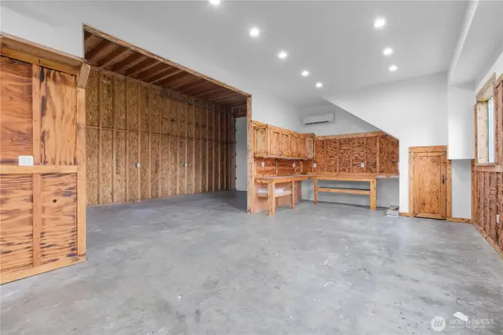 Shop has workbenches, lighting, mini-split heating and cooling