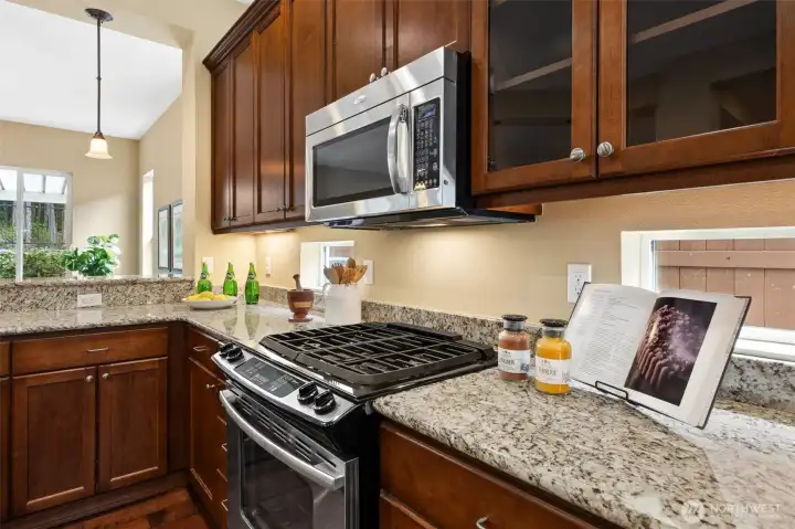 Gas range and 42" upper cabinets with glass fronts