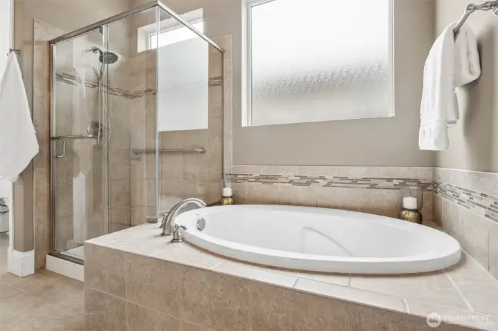 Soaking tub and shower with ceramic tile surround