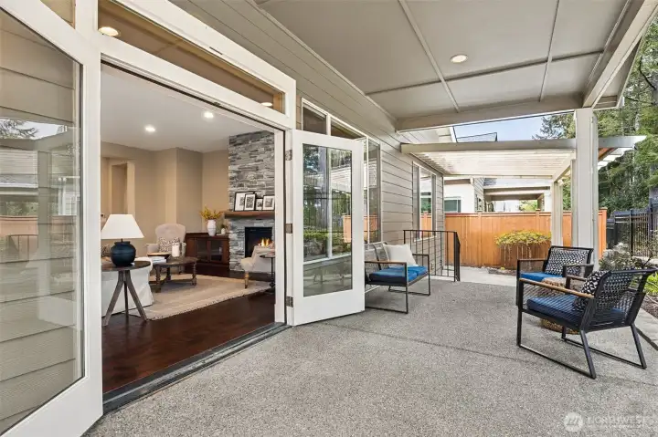 French doors open to 3 expansive covered patios
