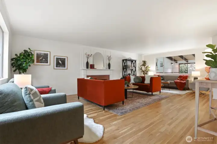 A very large entertaining sized living room with a cozy fireplace.