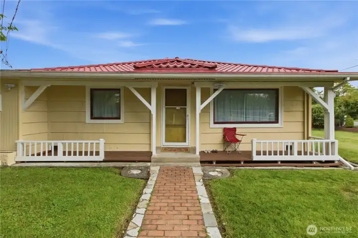 The front of the home features a classic covered porch, offering charm and everyday usability.