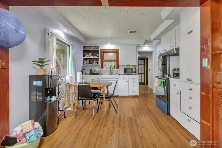 An open kitchen with a welcoming eating nook, perfect for casual dining and gathering.