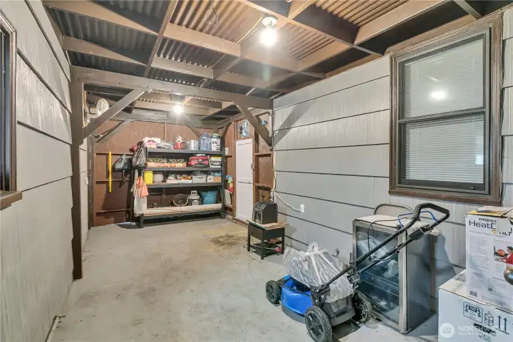 A versatile covered living area perfect for gatherings, hobbies, or extra storage space.