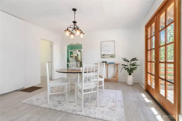 Dining area with a view through French doors Dining area with a view through French doors
