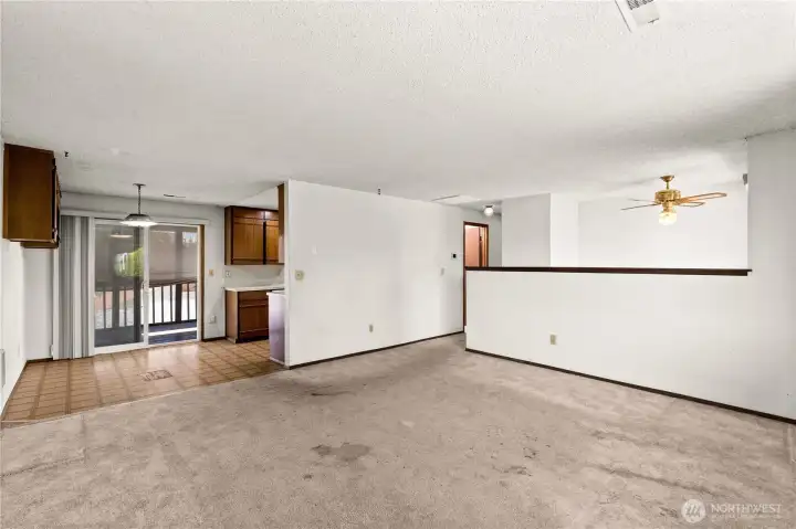2nd floor Living room looking towards dining area, kitchen, entry, and hallway bathroom