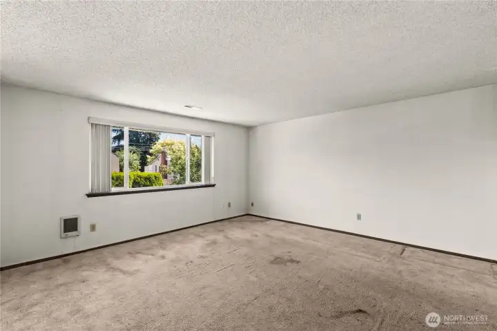 2nd floor Living room looking from top of stairs towards front of home window