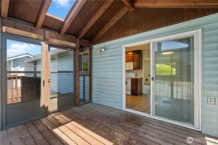 enclosed deck looking towards dining and kitchen