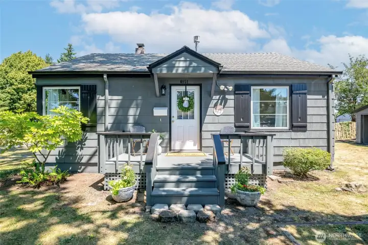 Welcome! Fresh exterior Sherwin Williams Grizzly Gray paint & Iron Ore trim.