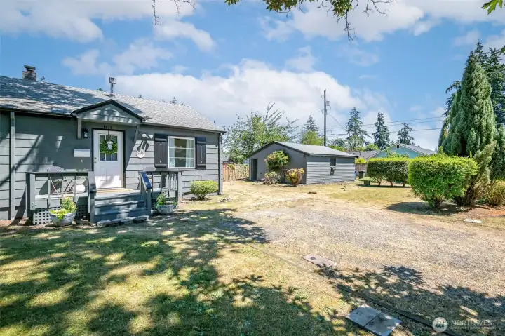 Gravel drive offers quick access to front door