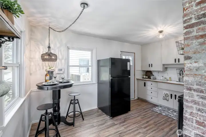 Simple kitchen with original chimney still present.