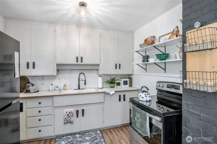 Updating lighting and new sink hardware compliment the classic feel.