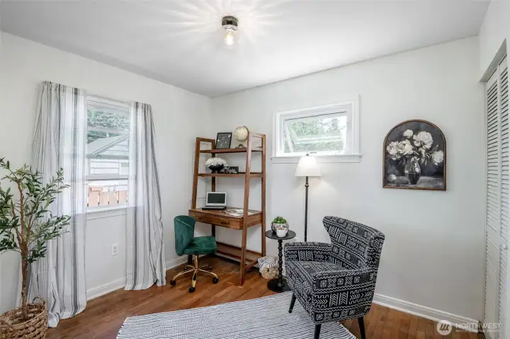 Back bedroom has hardwood floors, vinyl windows and generous bi-fold closet with organizer.