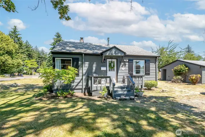 Newer roof, clean gutters, fresh paint, sturdy front porch, easy maintenance garden beds