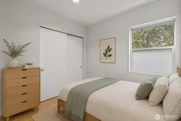 Bedroom with large storage closet (virtually staged)
