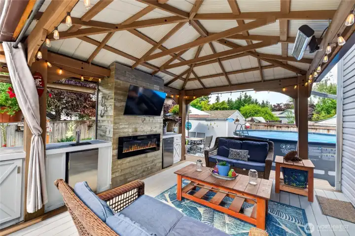 Covered Back Entertaining Deck with wet bar, fire and space for TV