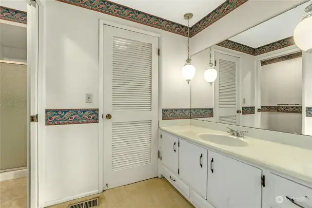 Primary bath with walk in shower and walk in closet.