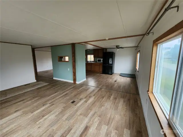 From the living room you can see options for a cozy breakfast eating with dining to the left of kitchen or additional restful living area.