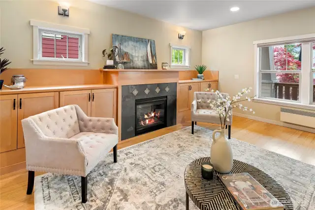 The living room has capacious maple cabinetry.