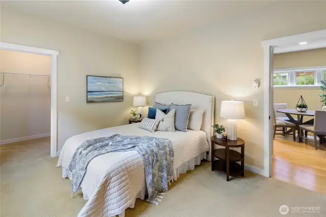 The primary bedroom is on the main level and has a large walk-in closet.