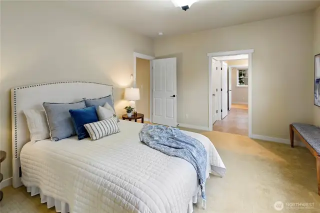 Primary bedroom and entrance to the ensuite bath.