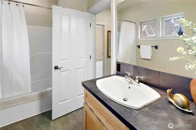 The upper bath includes sink, toilet, tub and shower.