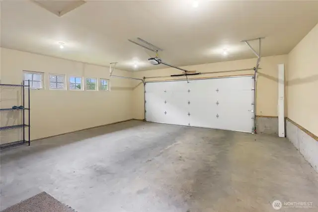 The two-car garage is large enough for two cars and a small shop.