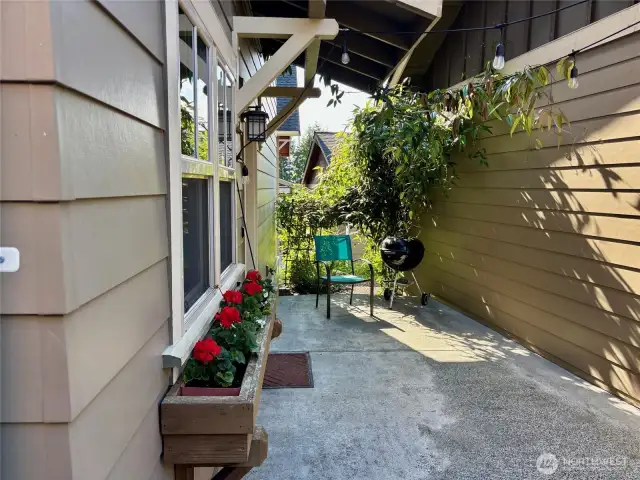 Most visitors will enter from the patio between the house and garage.