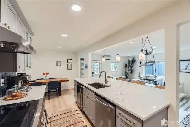 Tile backsplash, quartz countertops, beverage refrigerator...no expenses were spared during this kitchen remodel.