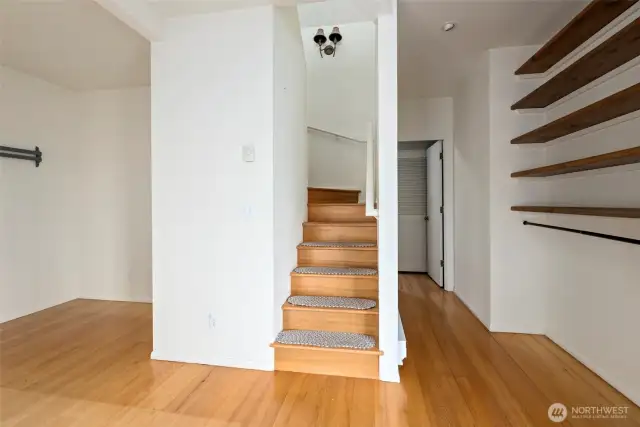 These stairs in the second bedroom suite lead up to a private loft space. The door on the right is the bathroom for this suite.