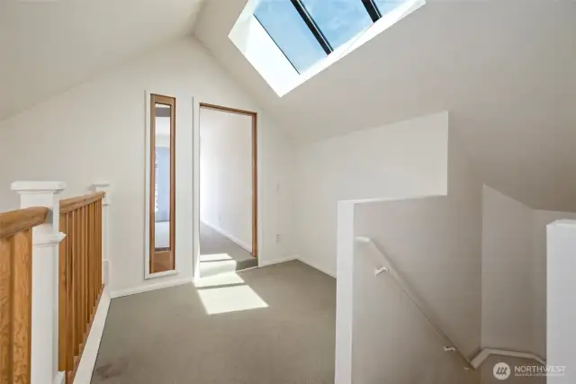 The upstairs loft with light filled office or hobby space. This also used to lead to a deck that is no longer there, but could easily be rebuilt.