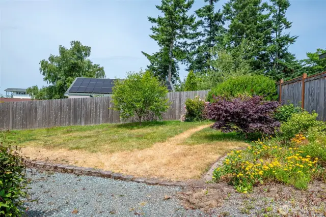 Private, fully fenced yard in the rear of the home.