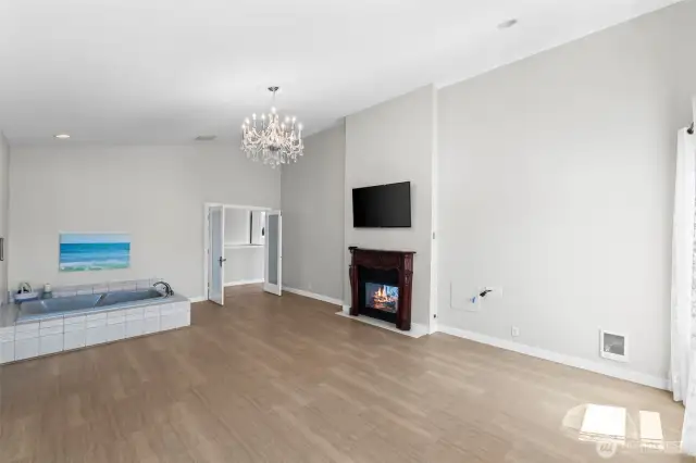 Main floor primary bedroom with two-way fireplace