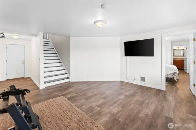 Downstairs bonus/living room. Exterior door to back yard (not pictured)