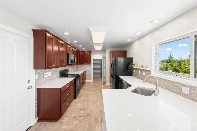 Beautiful and bright kitchen with quartz counters and quality cabinets