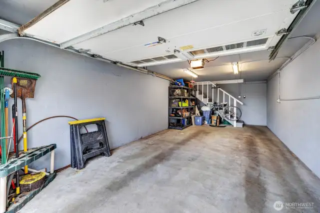 Garage with stairs leading into the Home