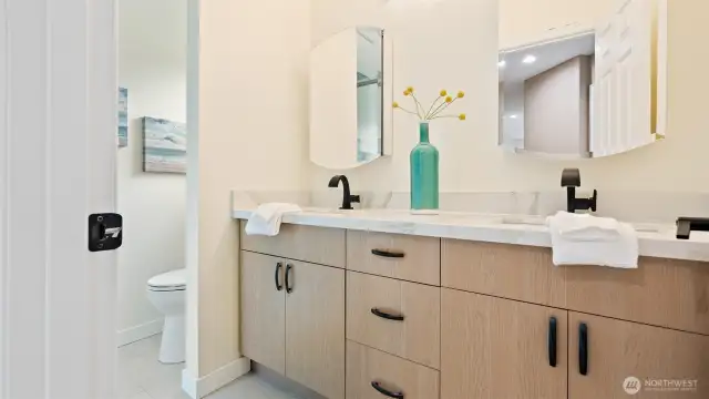 Remodeled 3/4 bathroom with fully tiled shower.