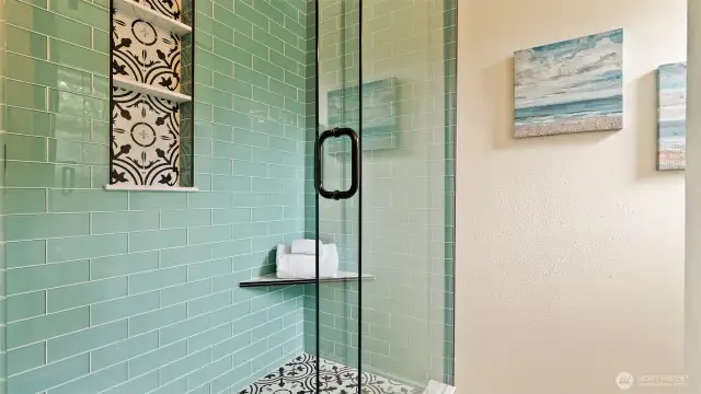 Remodeled 3/4 bathroom with fully tiled shower.