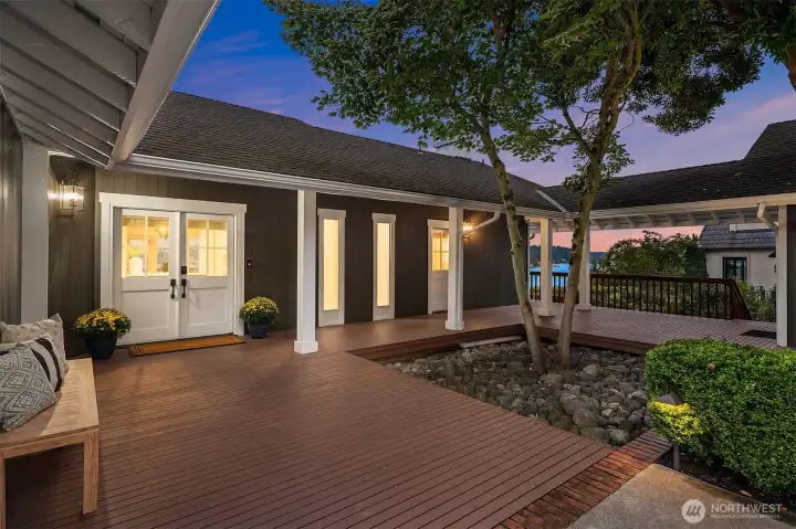 A covered breezeway leads to the pristine and secure two-car garage.