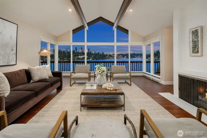The living room features vaulted ceilings with handsome beams and a gas fireplace.