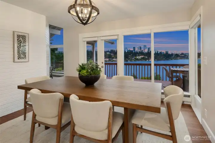 The dining room offers ample space to accommodate a large dinner party while overlooking the view.