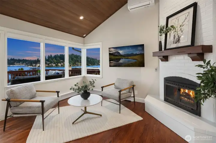 Adjacent to the kitchen is a family room with fireplace and abundant views.
