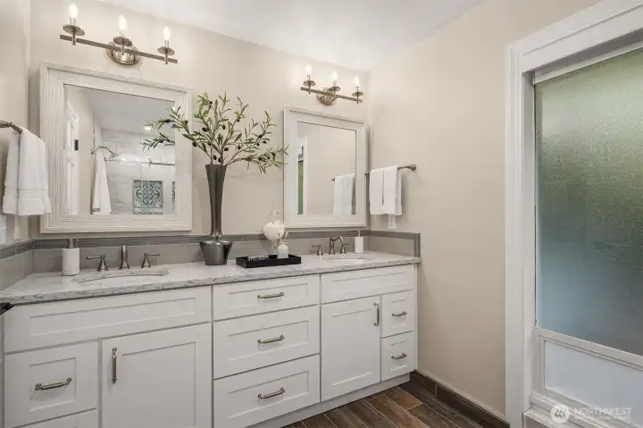 The remodeled primary bath features a large dual vanity.